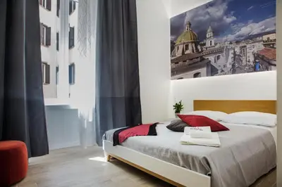 Letto o letti in una camera di Napolinn