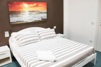 Letto o letti in una camera di Mascalzone latino luxury rooms