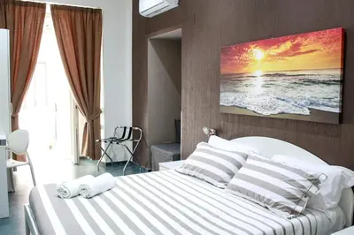 Letto o letti in una camera di Mascalzone latino luxury rooms