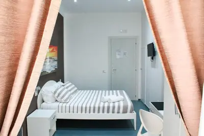 Letto o letti in una camera di Mascalzone latino luxury rooms