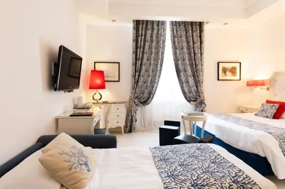 Letto o letti in una camera di La Ciliegina Lifestyle Hotel