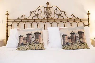Letto o letti in una camera di Domus Borbonica