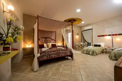 Letto o letti in una camera di Casa Mama
