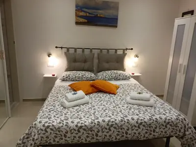 Letto o letti in una camera di Il Rifugio di Pulcinella