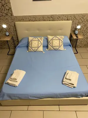 Letto o letti in una camera di Maradona Home