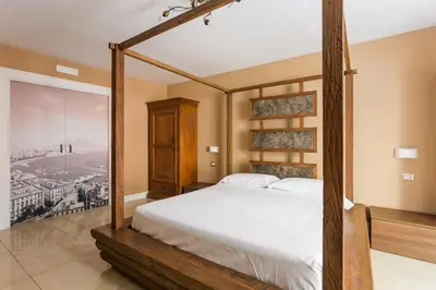 Letto o letti in una camera di Chiaia 205 By Dimorra