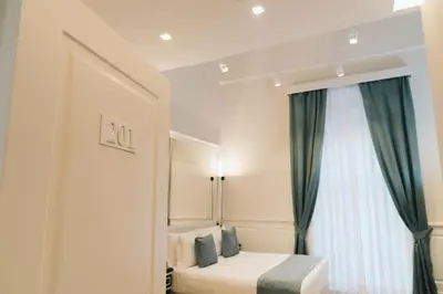 Letto o letti in una camera di Relais Piazza Vittoria