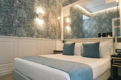 Letto o letti in una camera di Relais Piazza Vittoria