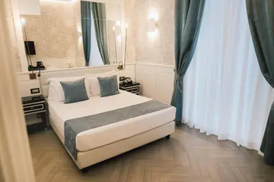 Letto o letti in una camera di Relais Piazza Vittoria