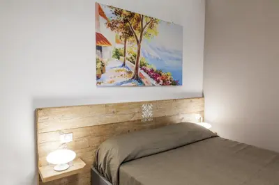 Letto o letti in una camera di Euforia Napoli - Tre Sedi - Three Locations