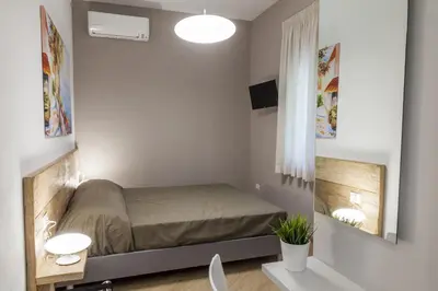 Letto o letti in una camera di Euforia Napoli - Tre Sedi - Three Locations