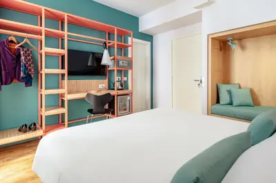 Letto o letti in una camera di Hotel Piazza Bellini & Apartments