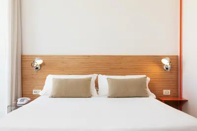 Letto o letti in una camera di Hotel Piazza Bellini & Apartments