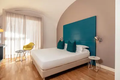 Letto o letti in una camera di Hotel Piazza Bellini & Apartments