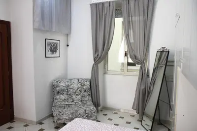 Letto o letti in una camera di Fira's home