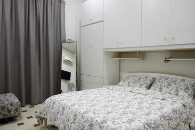 Letto o letti in una camera di Fira's home