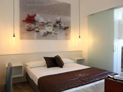 Letto o letti in una camera di Dimora Diamante