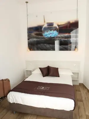 Letto o letti in una camera di Dimora Diamante