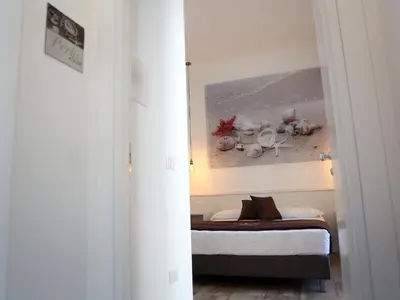 Letto o letti in una camera di Dimora Diamante
