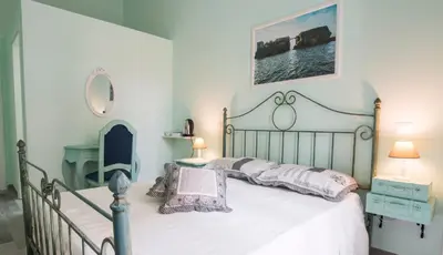 Letto o letti in una camera di Dimora Partenopea
