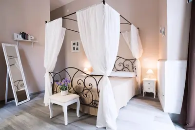 Letto o letti in una camera di Dimora Partenopea