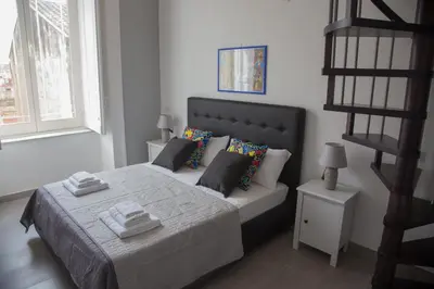 Letto o letti in una camera di Vesuvius Luxury Suites