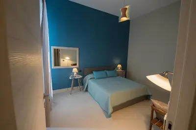 Letto o letti in una camera di Duomo Regina Apartments