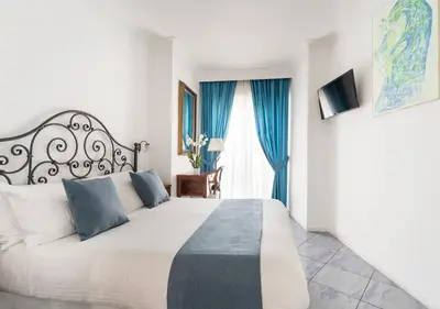 Letto o letti in una camera di Fiorentini Residence NAPOLI