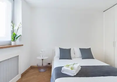 Letto o letti in una camera di Fiorentini Residence NAPOLI