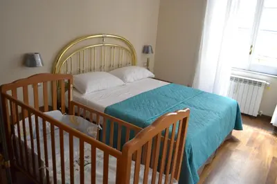 Letto o letti in una camera di Le Stanze di Dolly