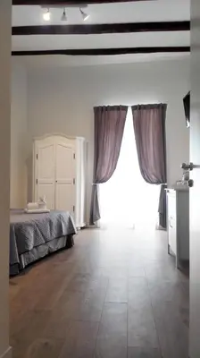 Letto o letti in una camera di Quartino Napoletano