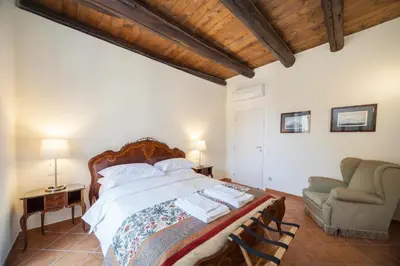 Letto o letti in una camera di Palazzo Marigliano