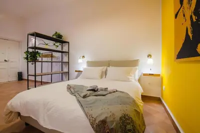 Letto o letti in una camera di Palazzo Marigliano