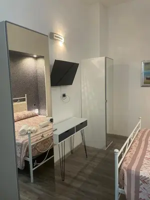 Letto o letti in una camera di B&B Plebiscito central suite