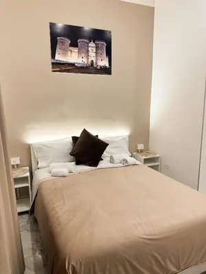 Letto o letti in una camera di Benvenuto a Napoli