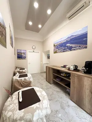 Letto o letti in una camera di Benvenuto a Napoli