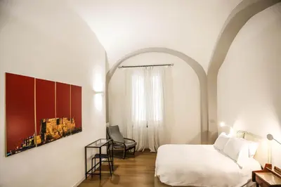 Letto o letti in una camera di Il Loggiato by Wonderful Italy