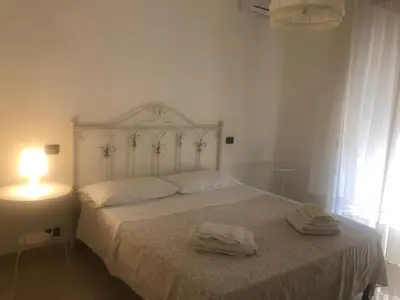 Letto o letti in una camera di Il Cuore di Napoli