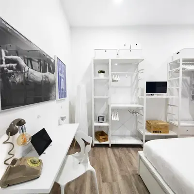 Letto o letti in una camera di Napulitano Assaje Home, arte e tradizione nel cuore del Centro Storico!