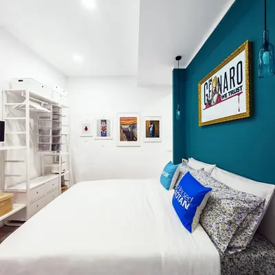 Letto o letti in una camera di Napulitano Assaje Home, arte e tradizione nel cuore del Centro Storico!