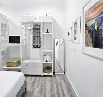 Letto o letti in una camera di Napulitano Assaje Home, arte e tradizione nel cuore del Centro Storico!