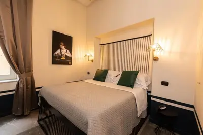 Letto o letti in una camera di Il Salotto della Regina