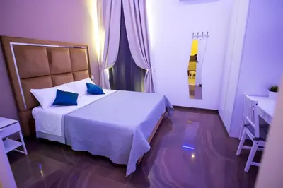 Letto o letti in una camera di Palazzo 15 Napoli
