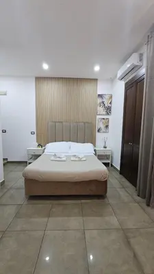 Letto o letti in una camera di B&B Napoli Centrale Room&Jacuzzi