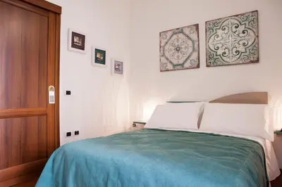 Letto o letti in una camera di Isa Guest Rooms