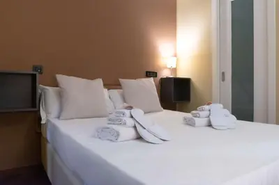 Letto o letti in una camera di Hotel Suite Ares