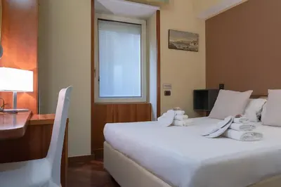 Letto o letti in una camera di Hotel Suite Ares
