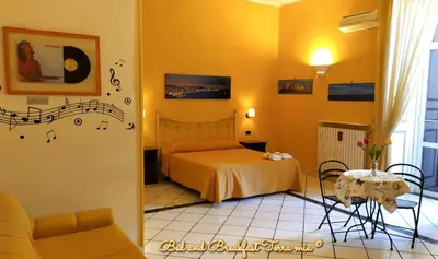 Letto o letti in una camera di B&B Terra Mia Napoli