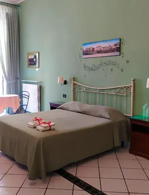Letto o letti in una camera di B&B Terra Mia Napoli