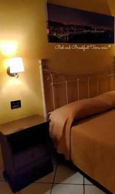 Letto o letti in una camera di B&B Terra Mia Napoli